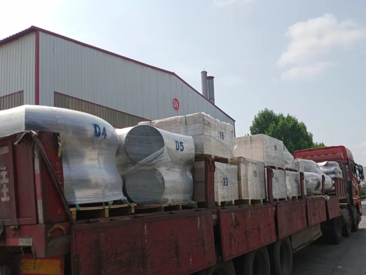 A batch of stainless steel pipe fittings is transported to Tanzania image